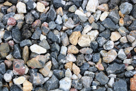A close-up view of colorful natural gravel rocks, perfect for backgrounds or textures.